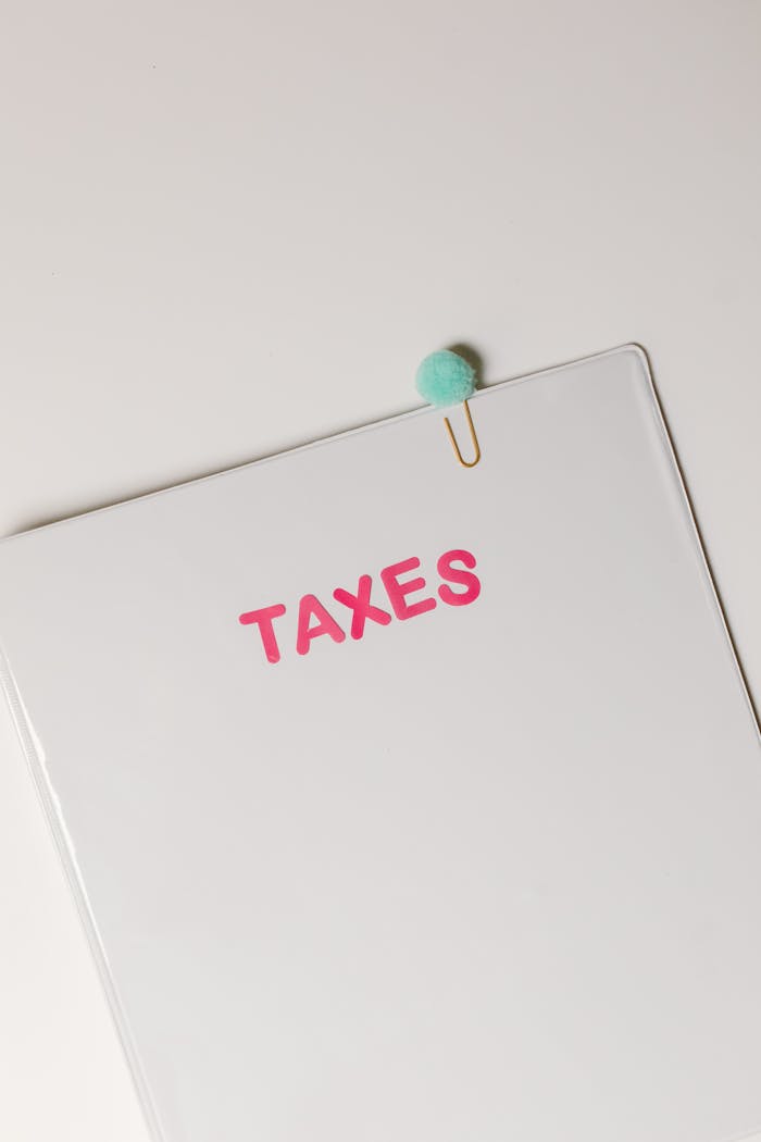 A tax document labeled 'TAXES' against a white background, conceptually representing finances.